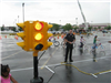 Officer Stands at Stop Sign While Observing Child