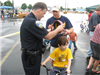 Community Member and Officer Talking About Helmet