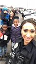 Officer Shendy with mother and children