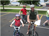 Man and Child Smile for Camera on Bikes