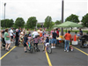 Volunteers Serve Food at Tent Area
