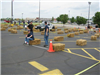 Volunteers Wait for Riders on Hay Bale