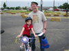 Child and Father Smile Before Bike Rodeo