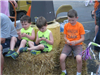 Children Sit on Hay Bale