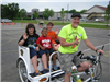 Children Wave on Bike Cart