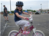 Girl Smiles With Sunglasses on Bike