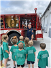 Fireman Jim Presents Next to a Fire Truck at Copley Township Safety Center on Day 3 of Safety Town 2025