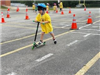 Safety Town Student Rides Scooter on Day 1 of Safety Town 2025
