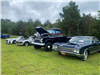 A Row of Cars and 1 Vintage Lifted Truck On Display at Car Show 2025
