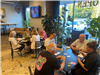 8 Residents Participating in the Euchre Tournament at Brighten Brewing for Heritage Days Game Night
