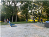 Residents Participating in the Corn Hole Tournament Outside at Brighten Brewing for Heritage Days Game Night