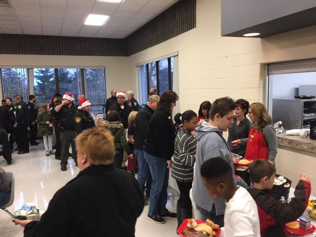 Officers and children in line for breakfast
