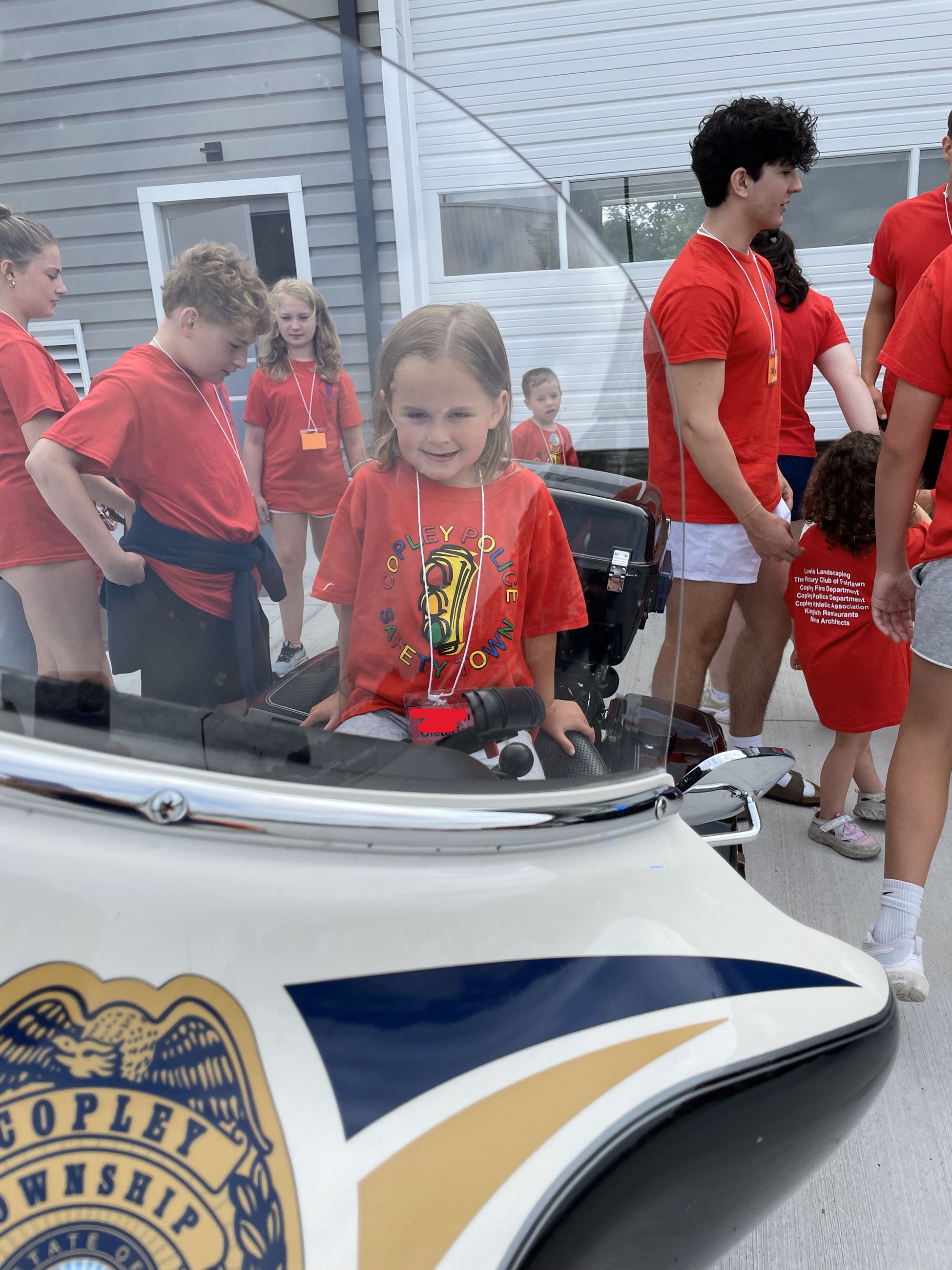 Safety Town Students Experience Being on a Police Motorcycle at Copley Township Safety Center on Day 3 of Safety Town 2025