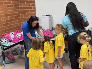 Safety Town Students Get Fitted for Helmets on Day 1 of Safety Town 2025