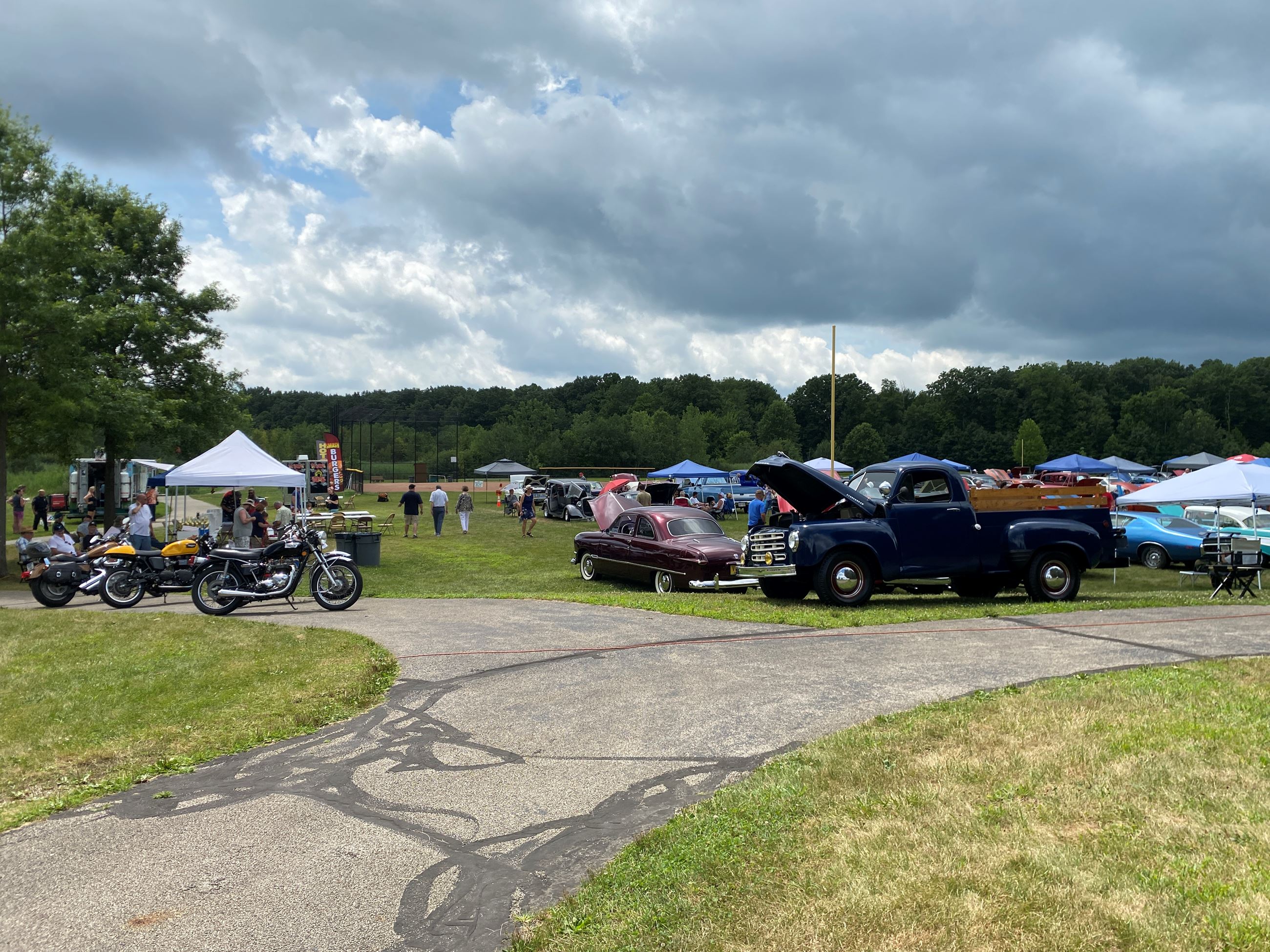 A landscape picture of the Food Trucks and Motorcycles at Copley Car Show 2025