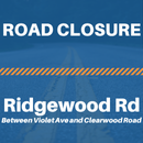 White text reading that there is a road closure, a blue background