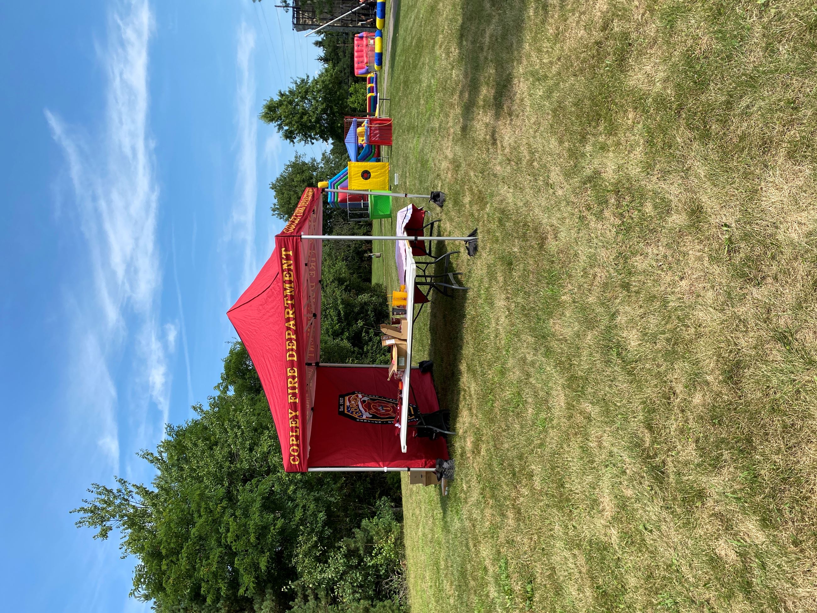 Red Copley Fire Department tent at Copley Community Park