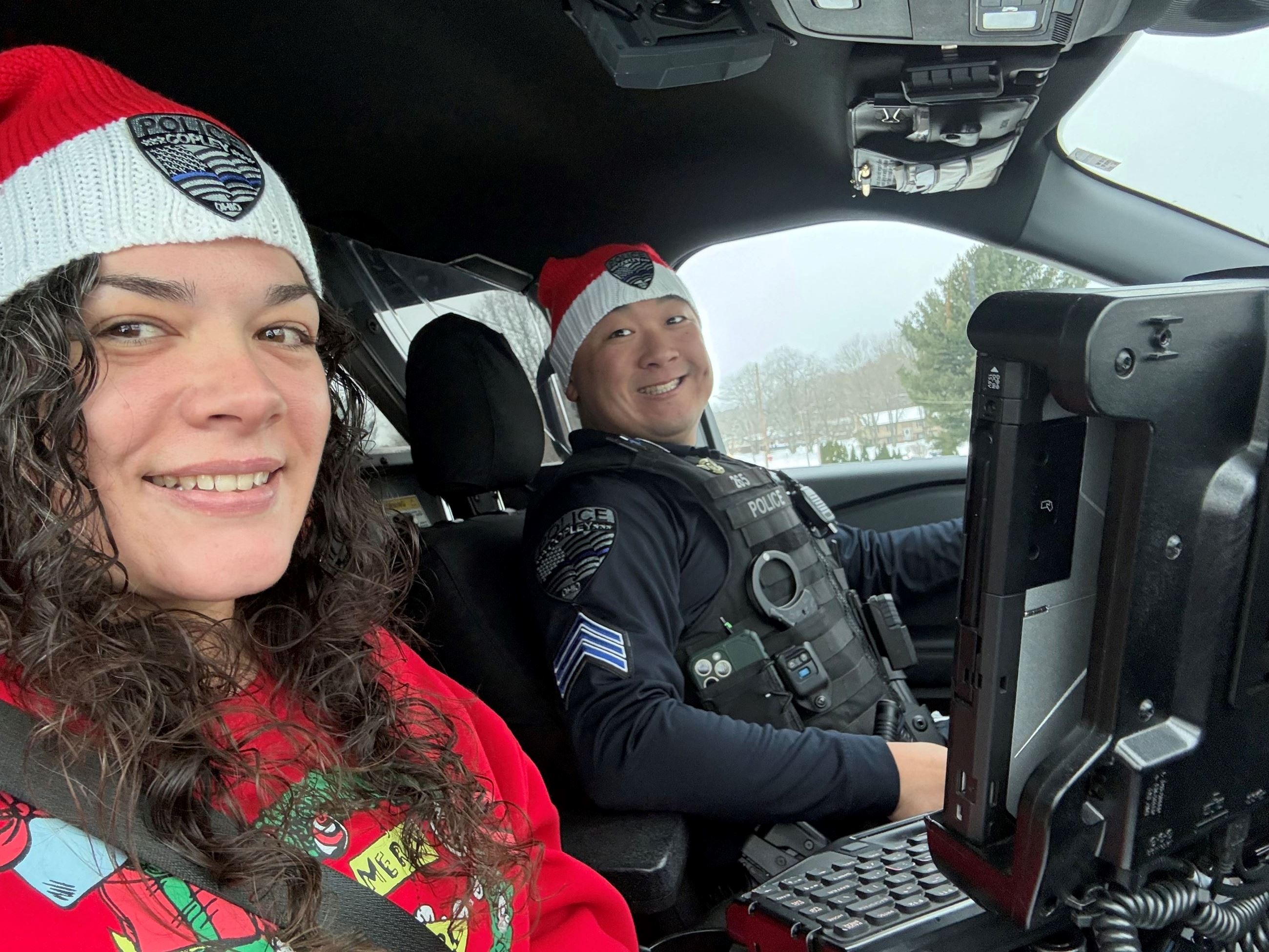 2 people sitting in a car